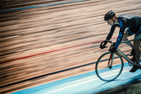 Racing cyclist on velodromeの写真素材