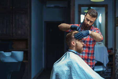 Young customer in barber shopの写真素材