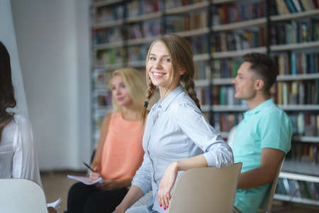Happy woman at meeting indoorsの写真素材