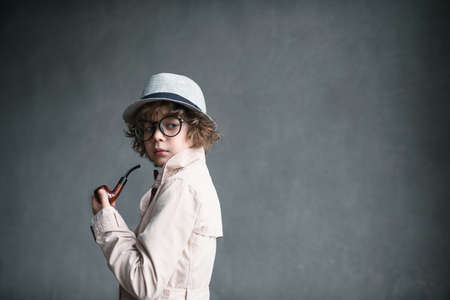 Little detective with a pipeの写真素材
