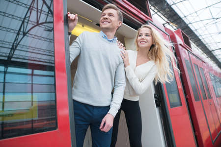 Traveling couple in a trainの写真素材