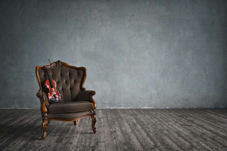 Violin on a chair indoorsの写真素材