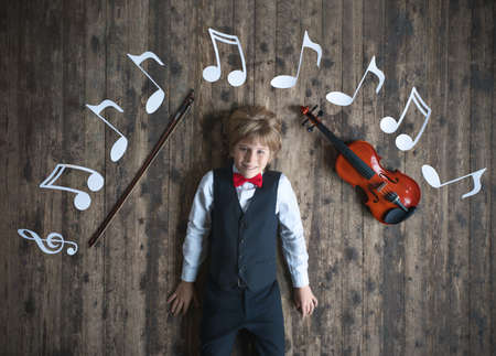 Little musician with violinの写真素材