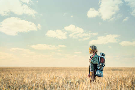 Boy with a backpack outdoorsの写真素材