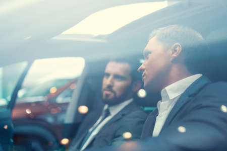 Two businessmen in carの写真素材