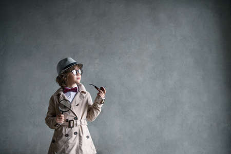 Little boy with a smoking pipeの写真素材