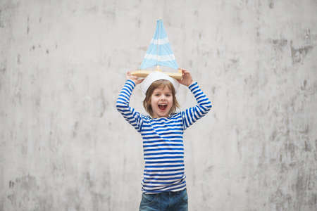 Happy sailor with a shipの写真素材