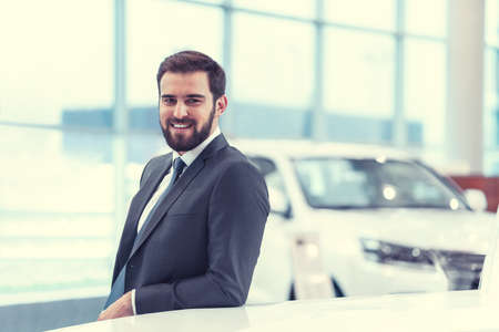 Smiling businessman indoorsの写真素材