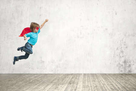 Flying superhero in studioの写真素材