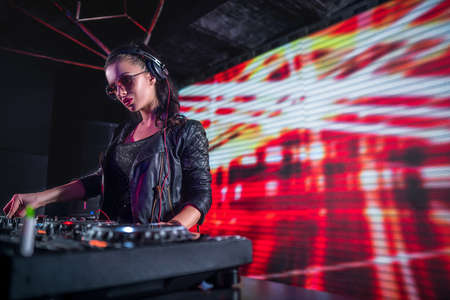 Young girl dj in nightclubの写真素材