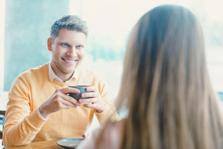 Young couple with a cups of coffeeの写真素材