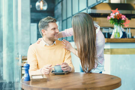 Attractive couple in cafeの写真素材