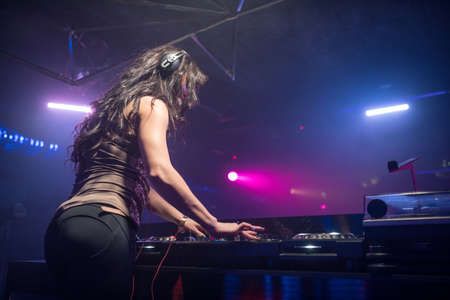 Attractive girl with dj mixerの写真素材