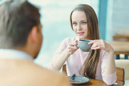 Meeting couple in cafeの写真素材