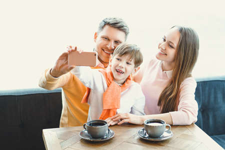 Family making selfie indoorsの写真素材