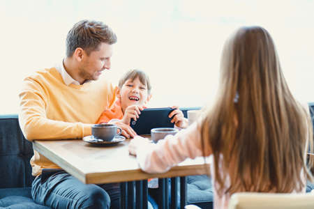 Happy family with child indoorsの写真素材