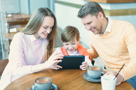 Smiling family with a childの写真素材