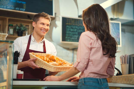 Smiling worker in bakeryの写真素材
