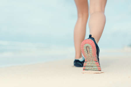 Female feet in sneakersの写真素材