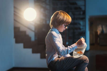 Little boy with goldfish