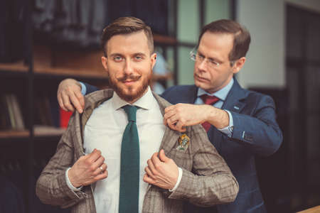 Smiling man in suit indoorsの写真素材