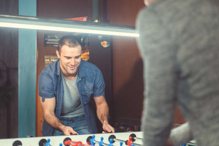 Smiling man playing a gameの写真素材