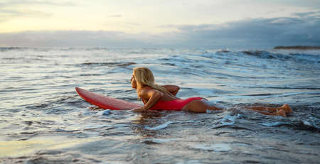 Sporty woman in the oceanの写真素材