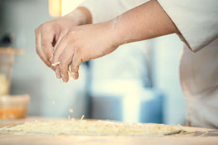 Chef cooking pizza indoorsの写真素材