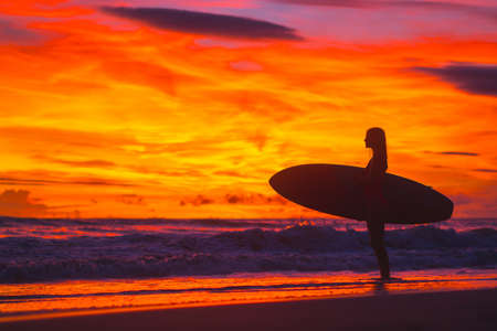 Young woman at sunsetの写真素材