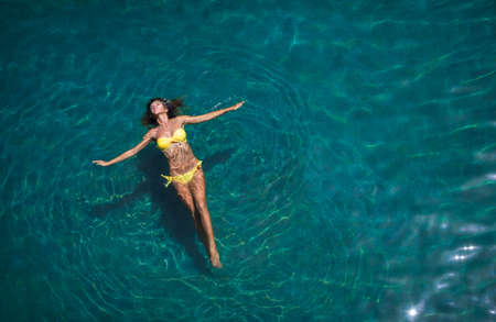 Attractive girl in the poolの写真素材