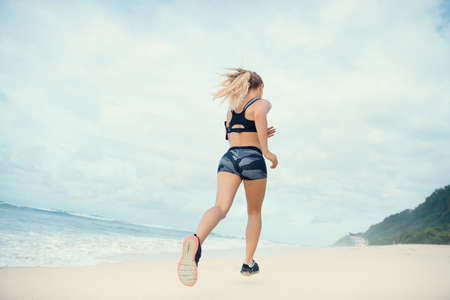 Young woman on the beachの写真素材