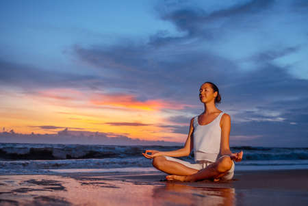 Woman in lotus position outdoorsの写真素材