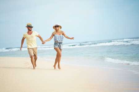 Happy couple on the beachの写真素材