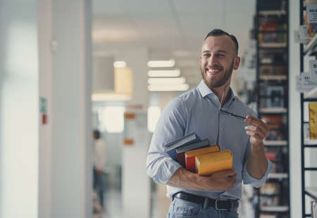 Smiling student with a booksの写真素材