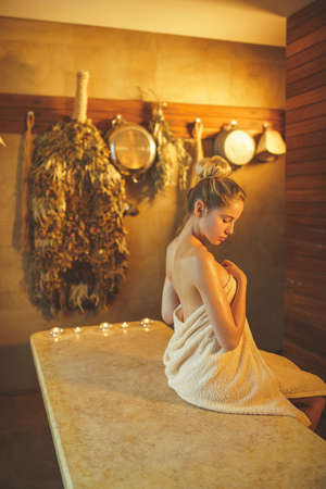 Beautiful young woman in spaの写真素材