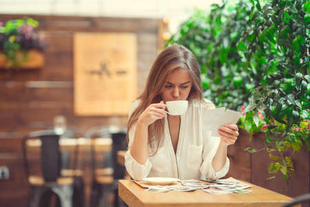 Beautiful young girl with coffee
