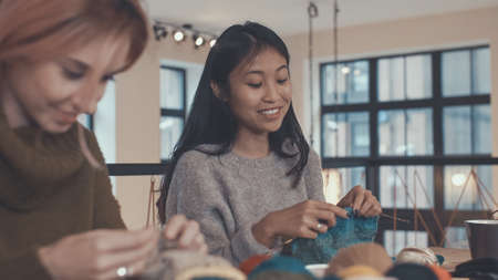 Smiling young woman in studioの写真素材