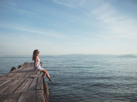 Young smiling on a pier