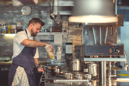 Young professional in the kitchenの写真素材