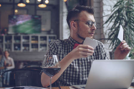 Young hipster with a picturesの写真素材