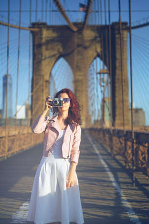 Young girl with a retro cameraの写真素材