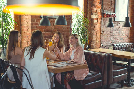 Happy young women in a cafeの写真素材