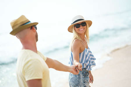 Smiling couple on the beachの写真素材