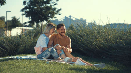 Smiling couple in love in the parkの写真素材