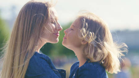 Smiling family in the park on vacationの写真素材