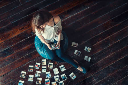 Young girl with a pictures on the floorの写真素材