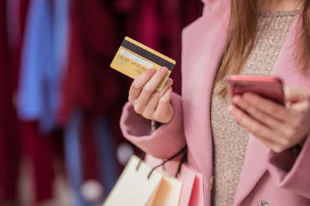 Young girl with a credit card close-upの写真素材