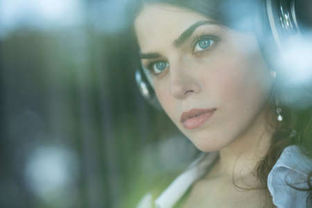 Young girl listen to music on headphones