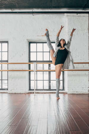 Young woman dancing in studio in the loftの写真素材