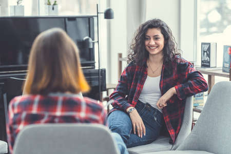 Smiling girls at meeting indoorsの写真素材